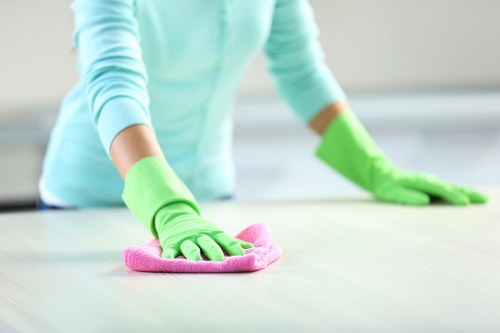 Technician preparing equipment safely before a carpet cleaning job