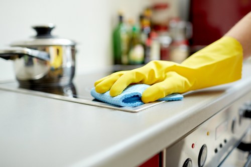 Technician applying carpet stain treatment in South Hackney